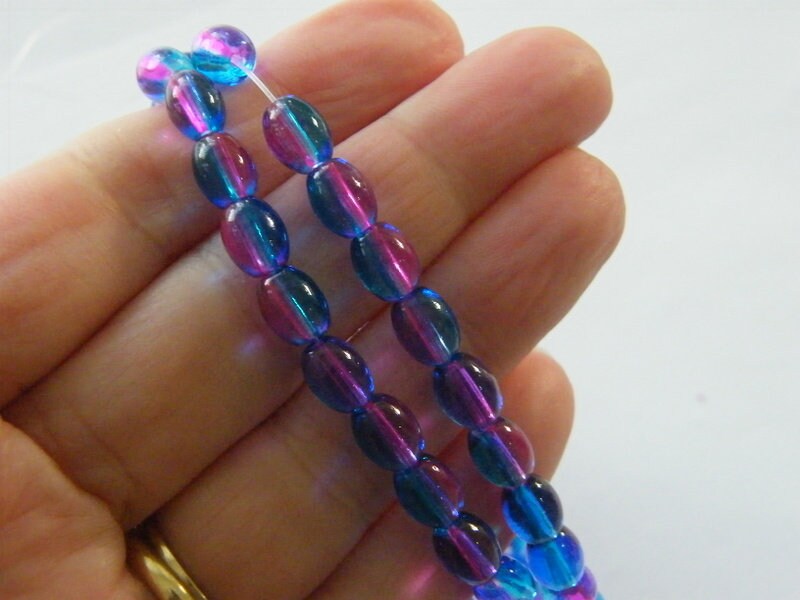 100 Blue and fuchsia oval beads glass B214