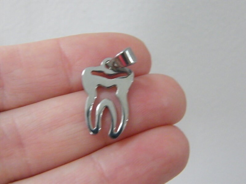 1 Tooth cut out pendant silver tone stainless steel MD30