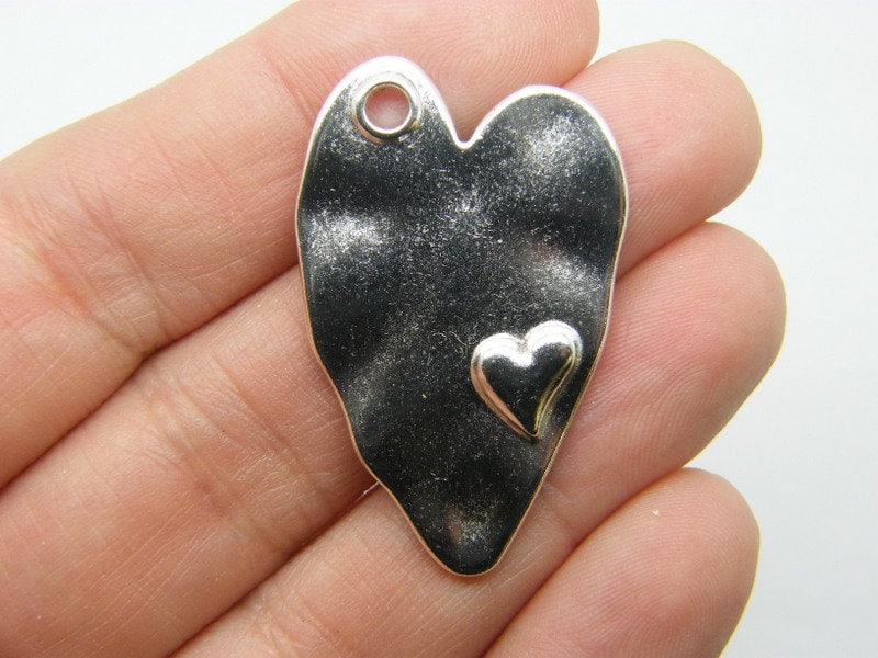 4 Heart pendants silver tone H82