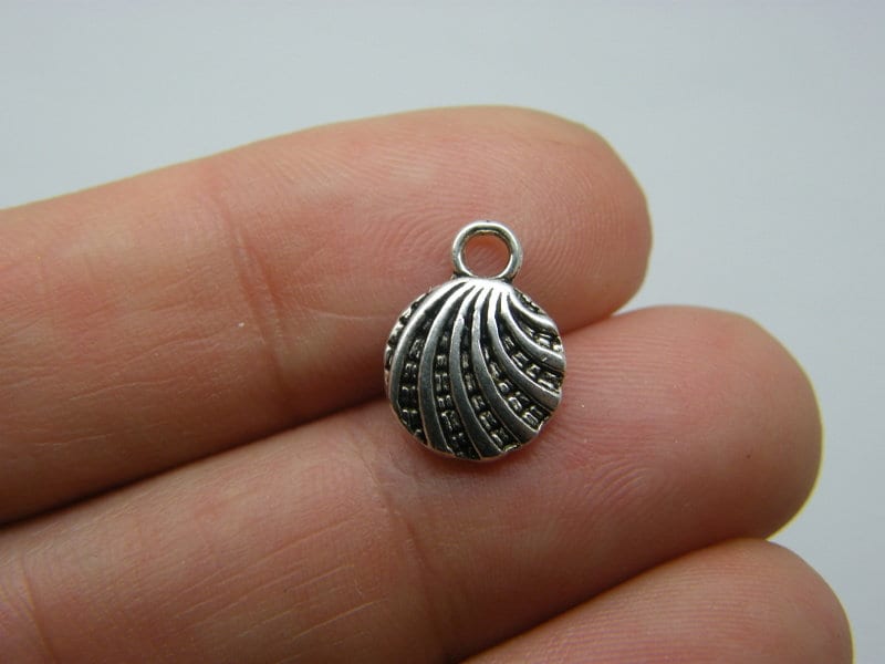 16 Shell charms antique silver tone FF7