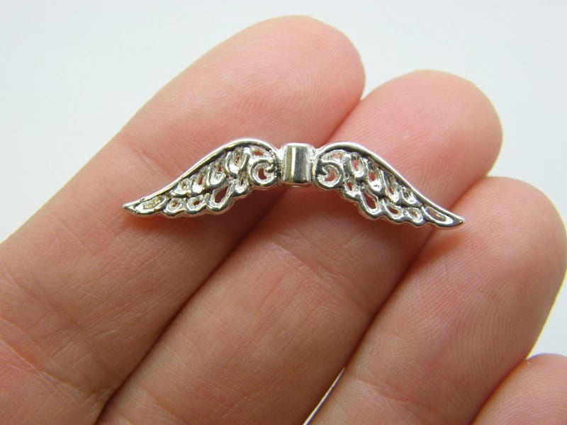 BULK 50 Angel wing spacer beads silver plated tone AW22