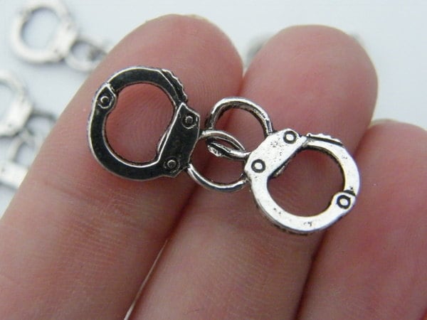6 Pair of handcuff charms antique silver tone G24