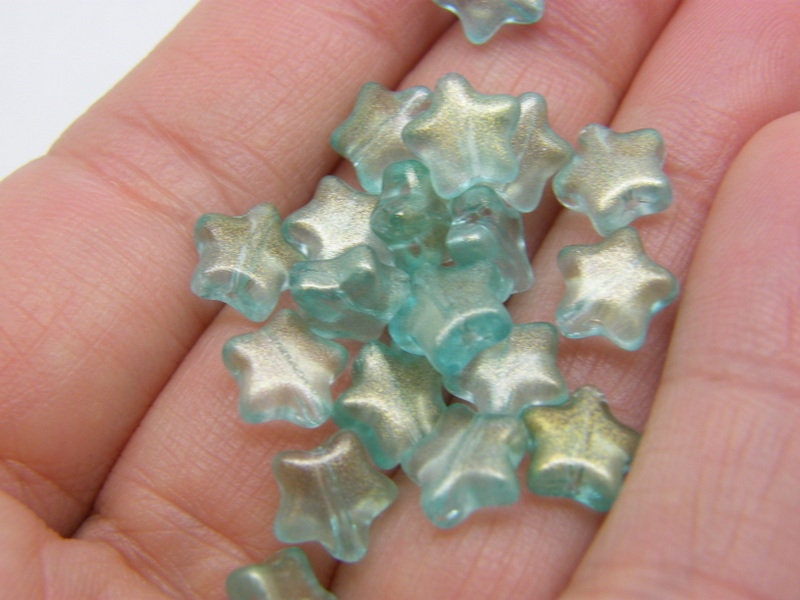 30 Star beads AB green glass AB332