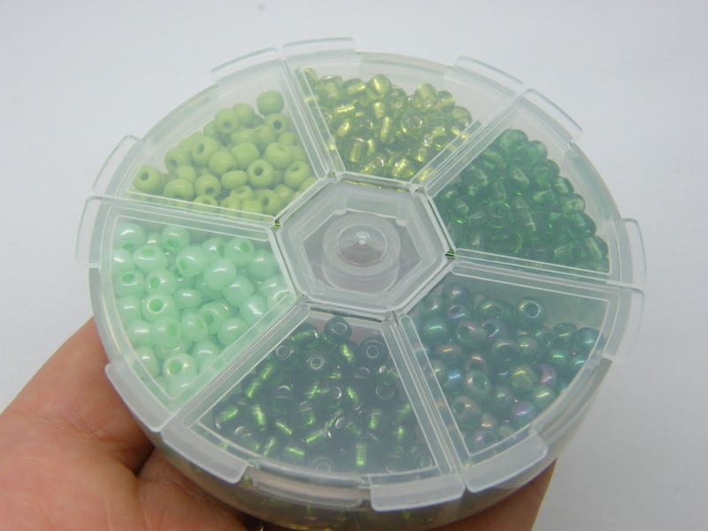 1 Storage box with 6 different green 4mm seed beads