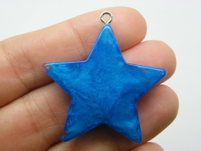 4 Stunningly beautiful Star pendants blue resin S59