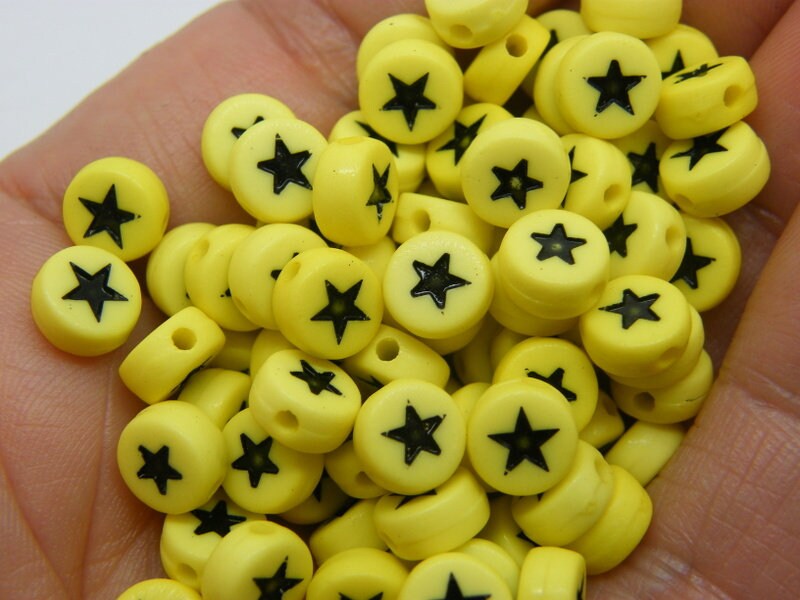 100 Star beads yellow black acrylic AB369  - SALE 50% OFF