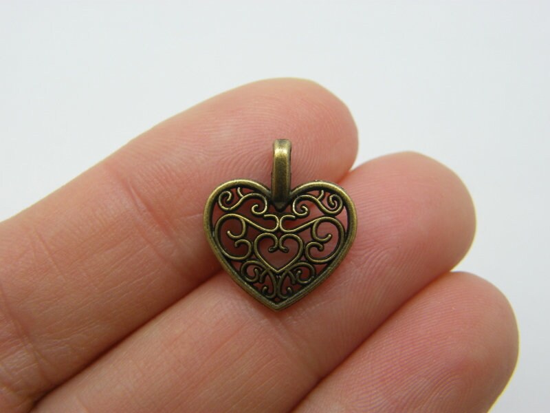 12 Heart charms pendants antique bronze tone H98