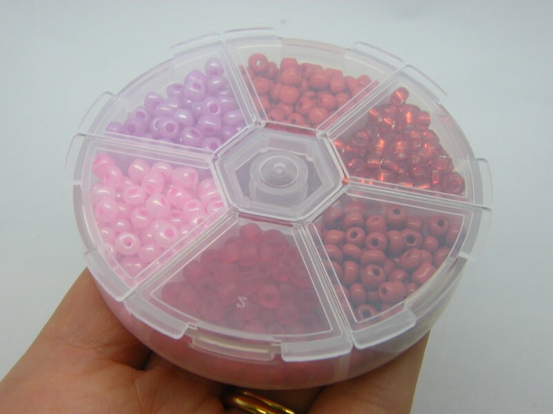 1 Storage box with 6 different pink and red 4mm seed beads