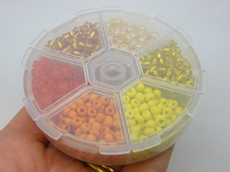 1 Storage box with 6 different orange yellow 4mm seed beads