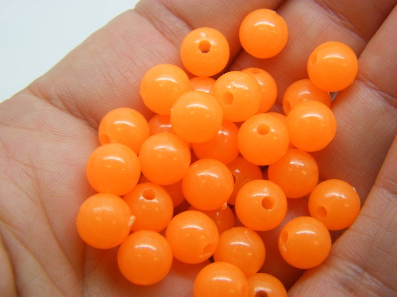 100 Orange glow in the dark beads 8mm acrylic AB411