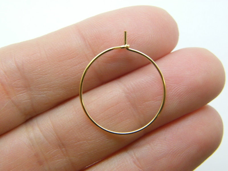 24 Wine hoops 24 x 20mm 01F golden surgical stainless steel FS136