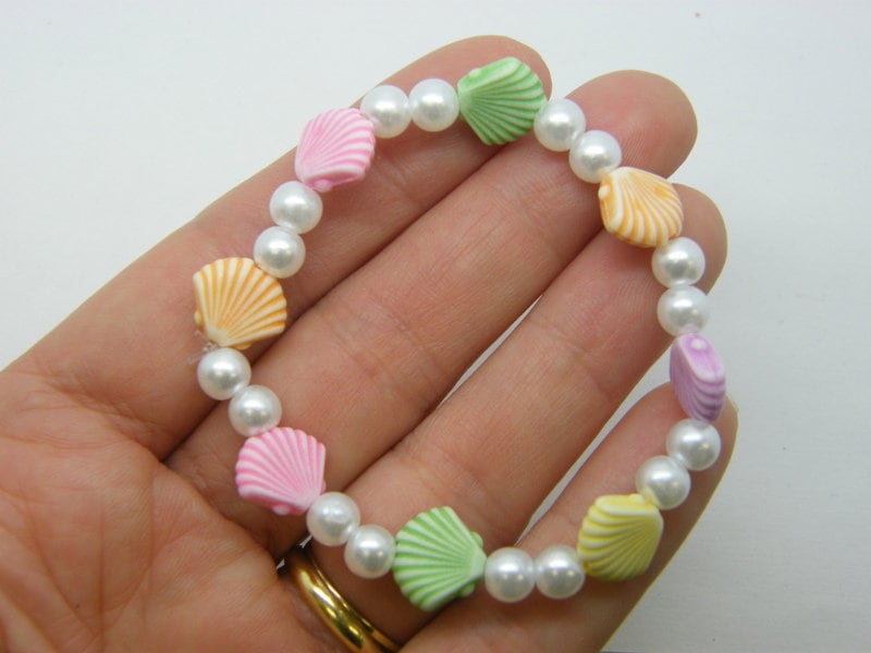 6 White shell bracelets 43mm stretchy plastic beads FS