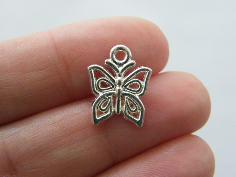 14 Butterfly charms silver plated tone A1132