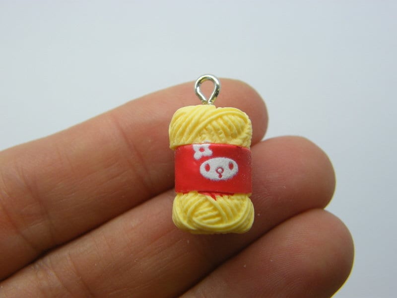 2 Balls of wool yarn pendants yellow resin P255