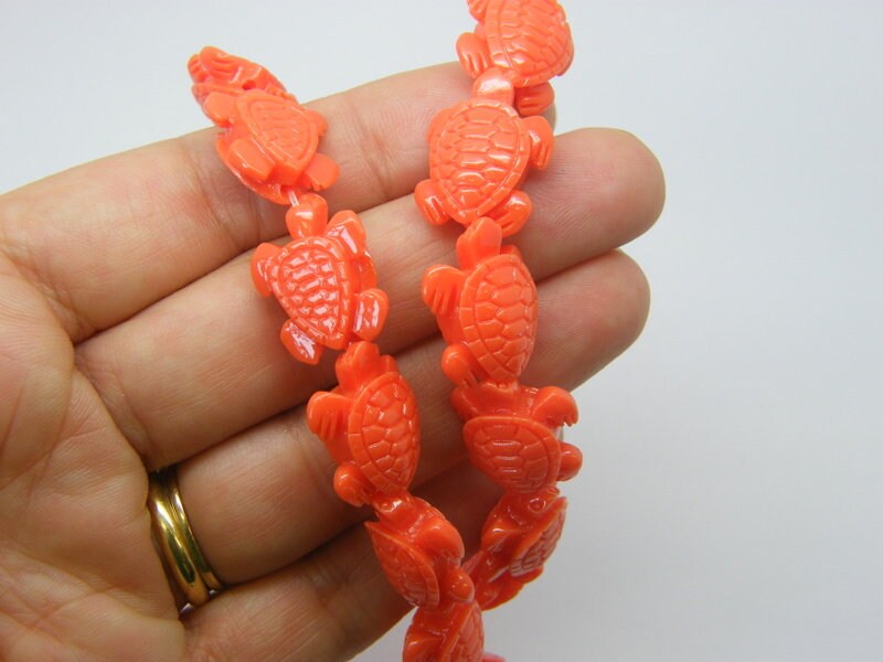 20 Turtle spacer beads synthetic resin orange FF