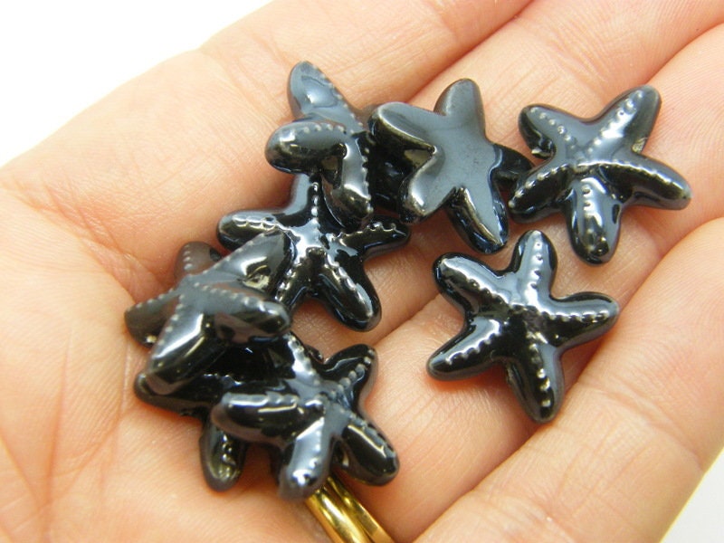 8 Starfish beads black ceramic FF624