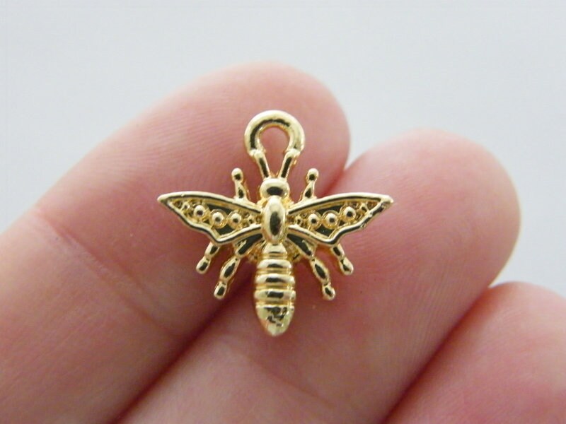 8 Bee charms gold tone A1100