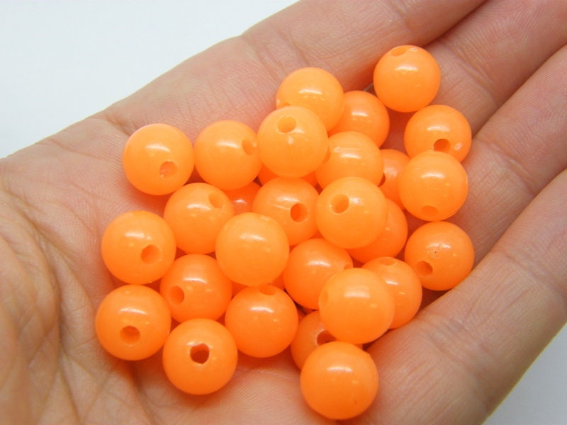 50 Glow in the dark round beads 10mm orange acrylic BB368 - SALE 50% OFF