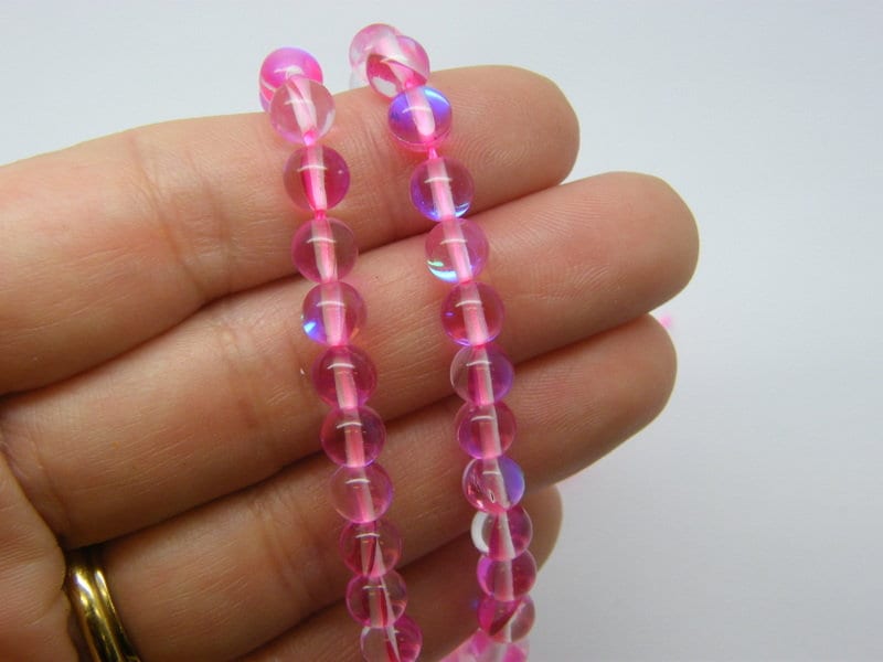 60  Beads imitation moon stone deep pink holographic  6mm glass OB182