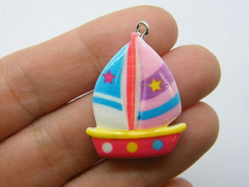 4 Sailing boat charms resin TT93