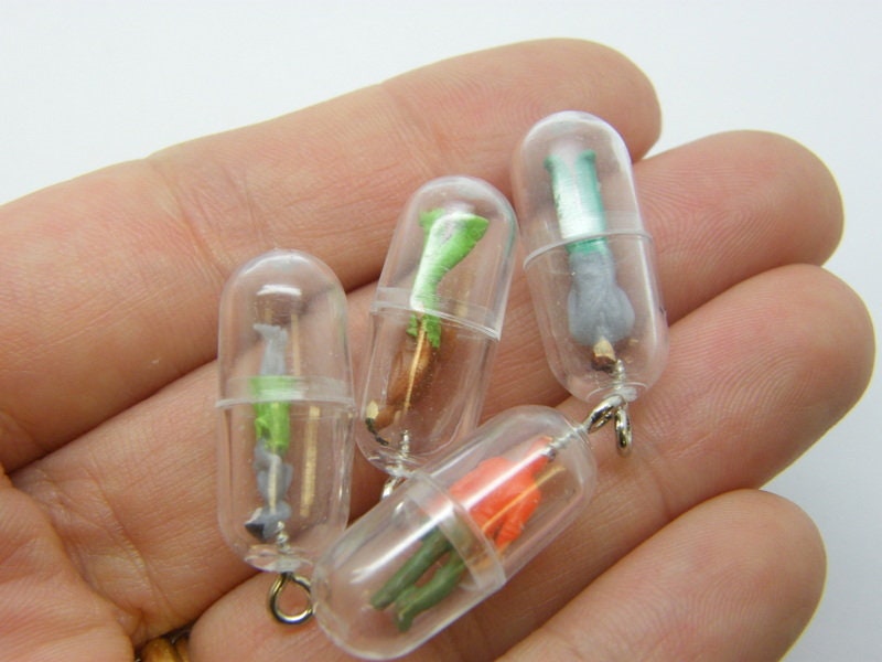 6 People in capsule charms random mixed plastic M63