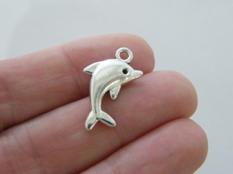 8 Dolphin charms antique silver tone FF77