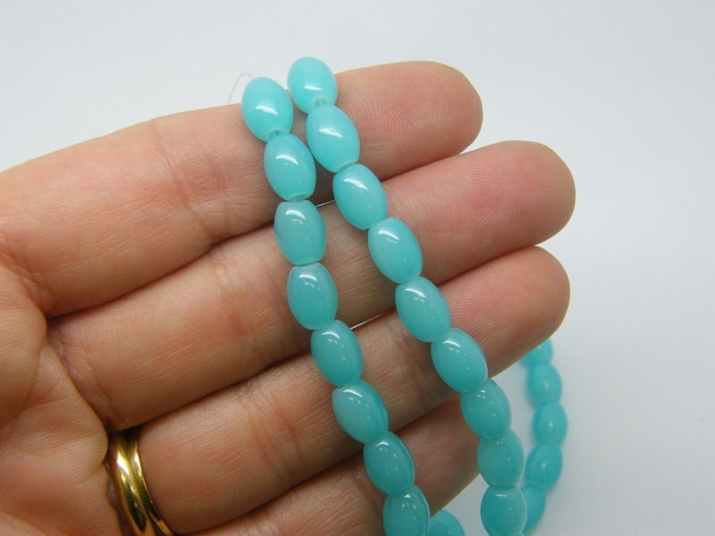 94 Blue oval imitation jade beads 8 x 6mm glass B287