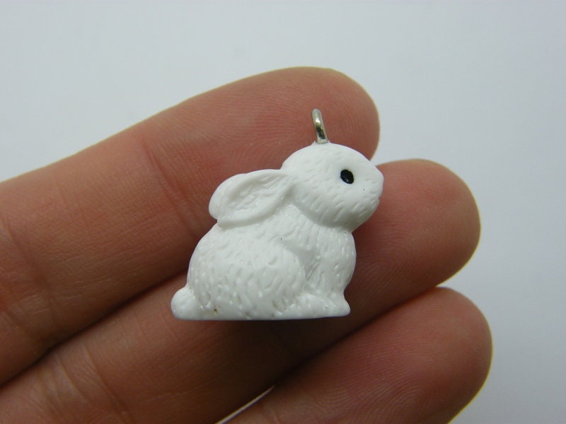 2 Rabbit charms white resin A445