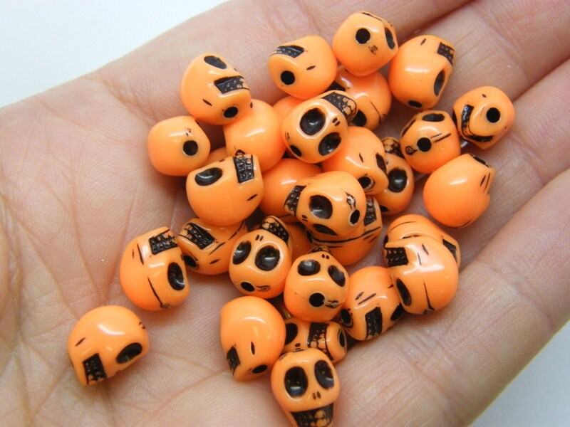 80 Skull beads orange and black acrylic BB339