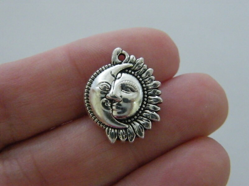 12  Moon and sun faces charms pendants antique silver tone M169