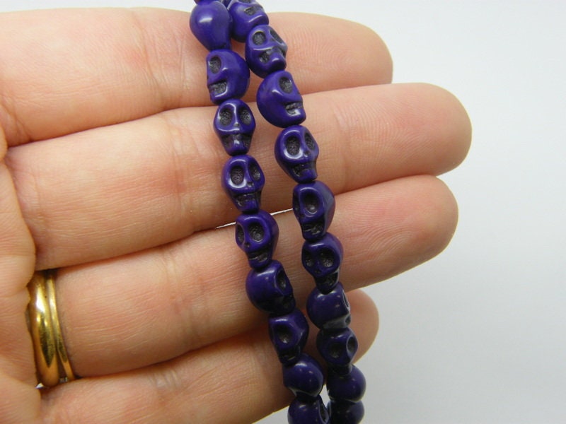 48 Purple skull beads 8 x 6mm SK13