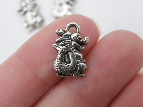 14 Dragon charms antique silver tone A17