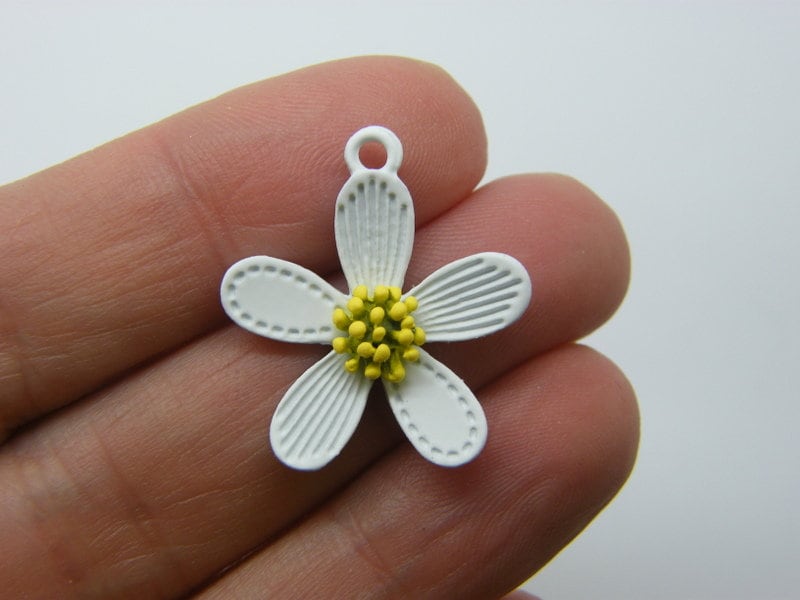 4 Flower pendants white yellow tone F338