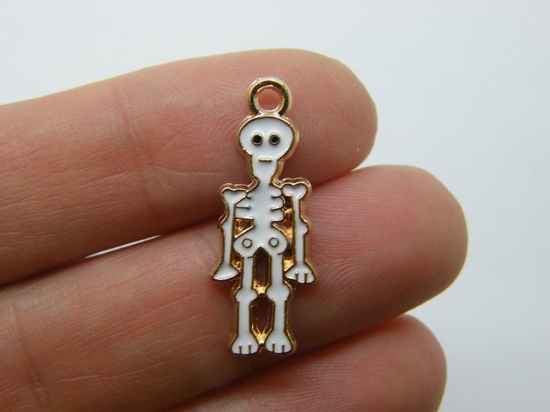 8 Skeleton charms white gold tone HC782