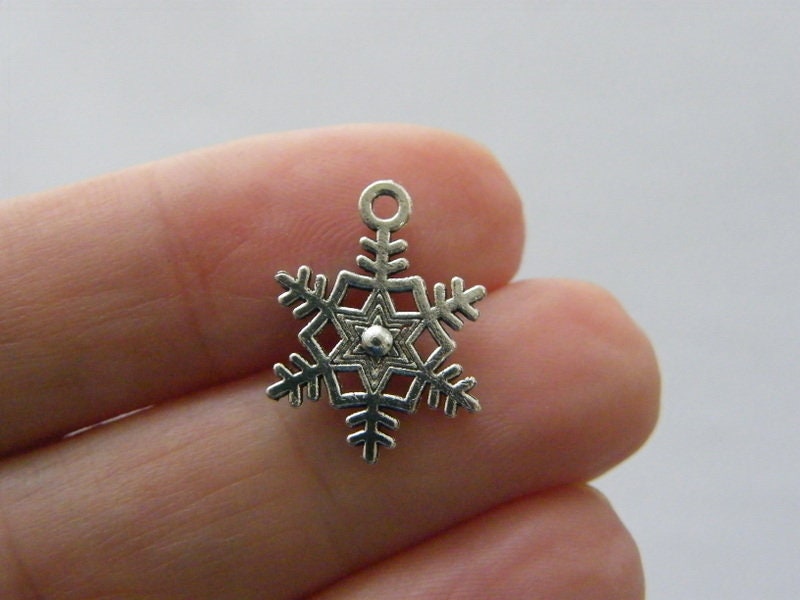 10 Snowflake Christmas charms antique silver tone SF21
