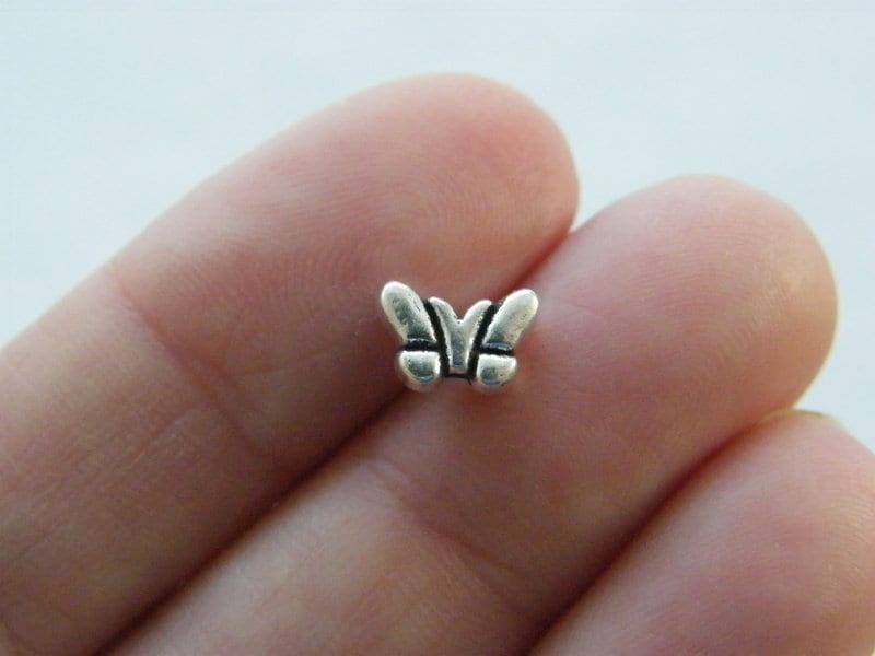 14 Butterfly spacer beads antique silver tone A1313