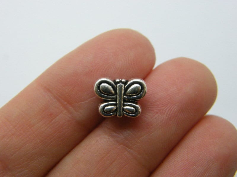 14 Butterfly spacer beads antique silver tone A371