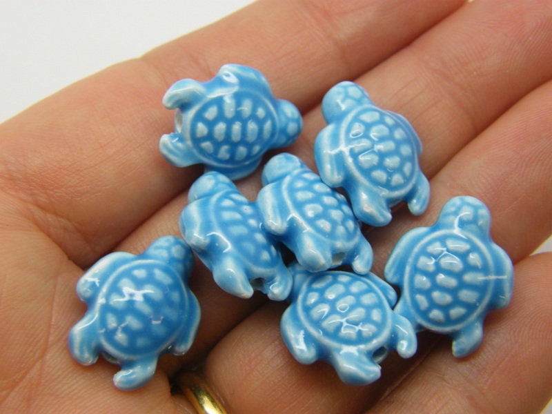 8 Turtle beads blue porcelain FF258