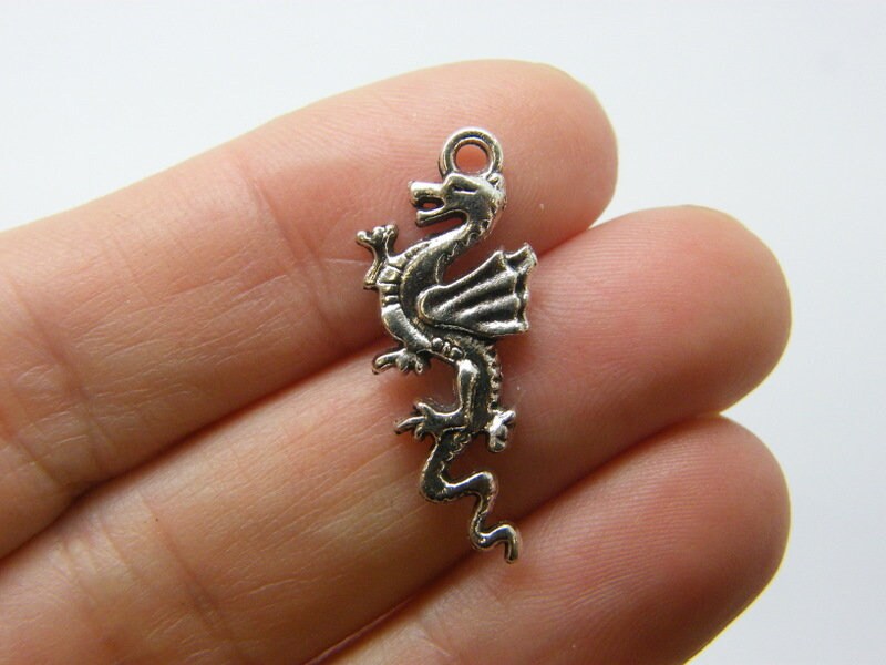 8 Dragon charms antique silver tone A164