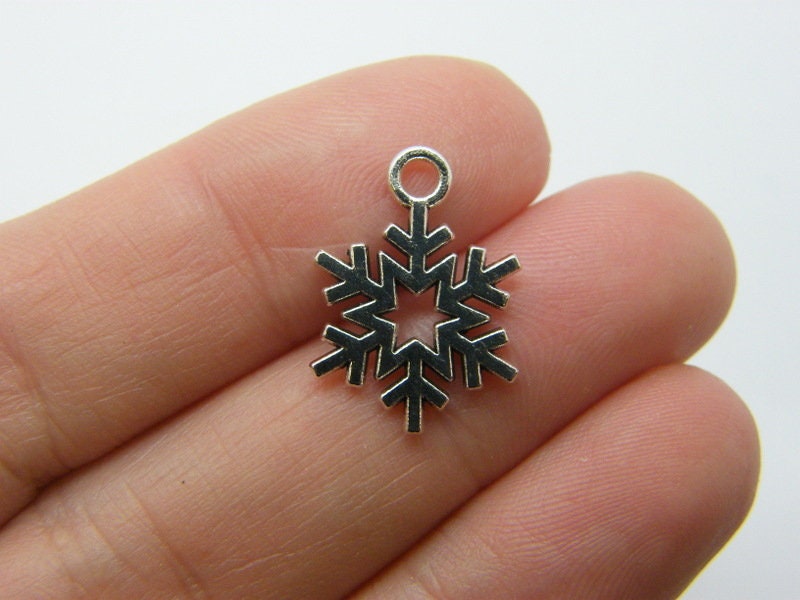 10 Snowflake Christmas charms antique silver tone  SF29