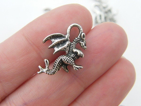 8 Dragon charms antique silver tone A80