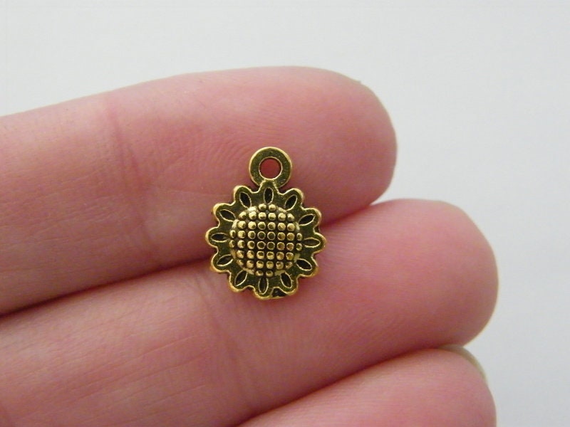 12 Sunflower charms antique gold tone F263