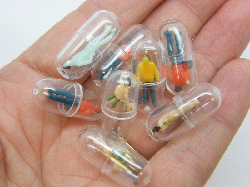 8 People in capsule embellishment random mixed plastic M165