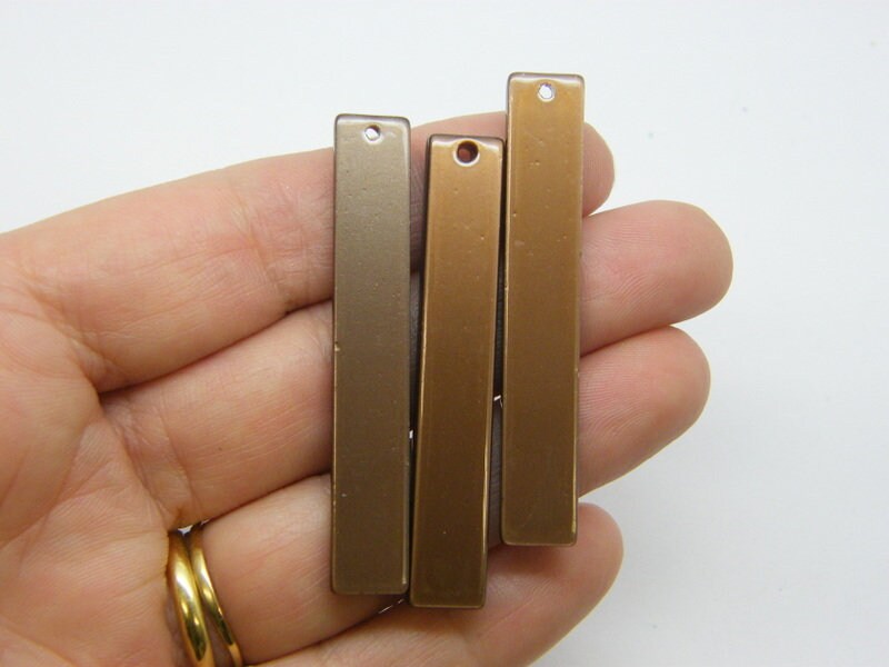 4 Rectangle pendants brown resin M195