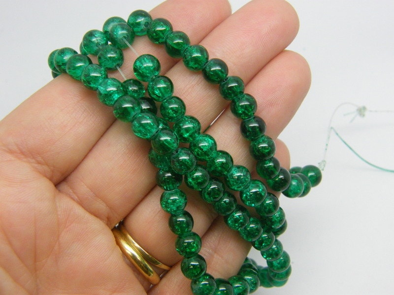 140 Green crackle beads 6mm glass B120