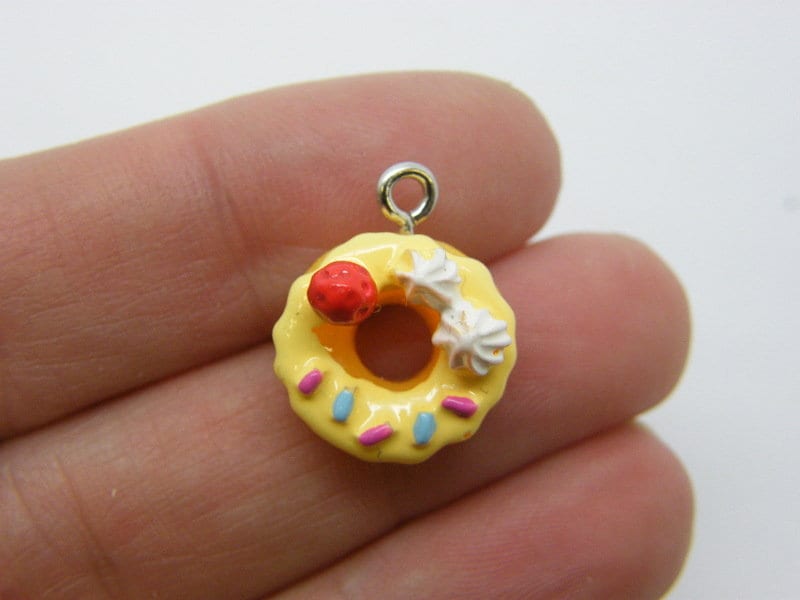 4 Donut charms  yellow resin FD50