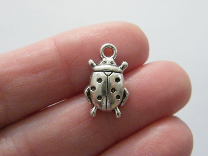 10 Ladybug charms antique silver tone A272
