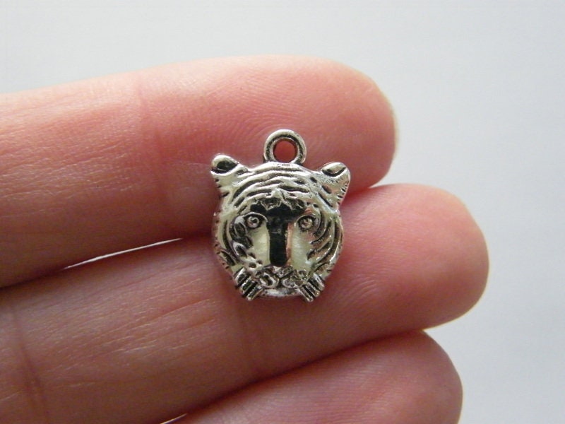 10 Tiger charms antique silver tone A5