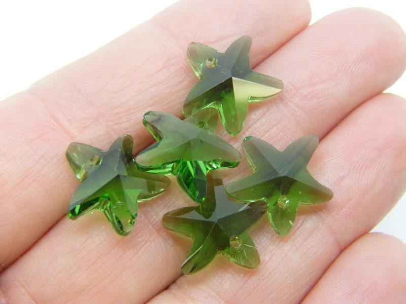 10 Starfish charms dark green glass FF633