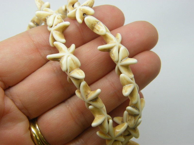 35 Starfish beads off white 14 x 14mm 03B